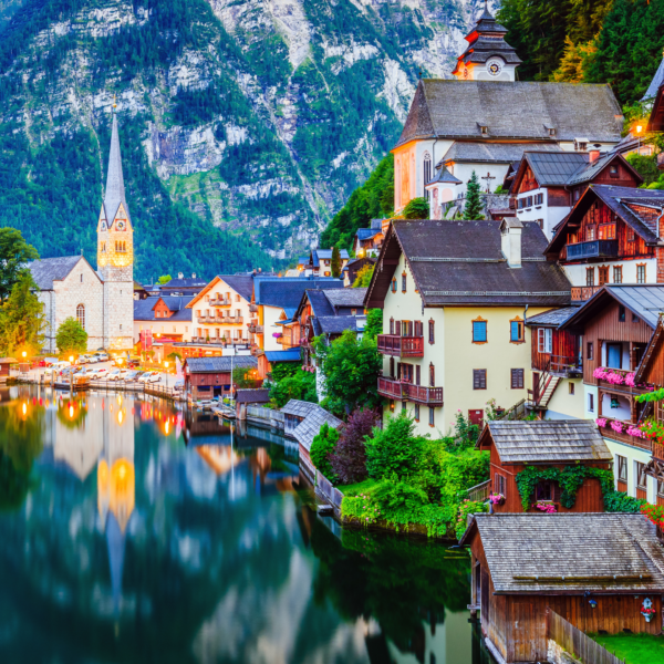 austrian village beside a large lake with mountains