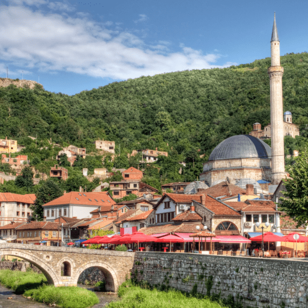 Kosovo city of Prizren with mosque in town and fortress on hill