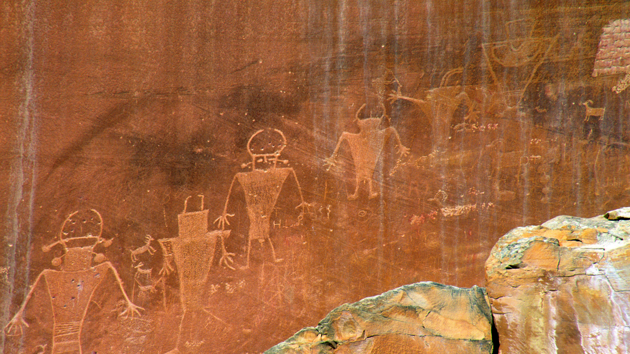 petraglyphs on red rock looks like creatures from mars