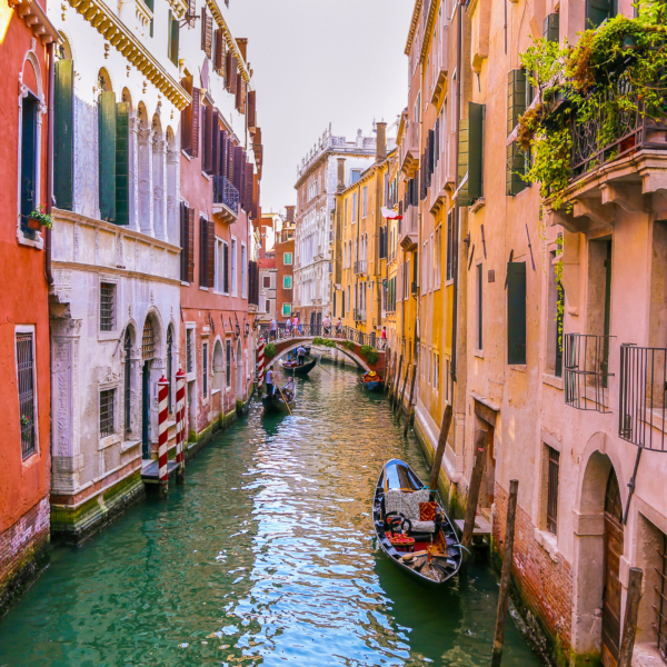 venice Italy canals with small boats and colorful houses