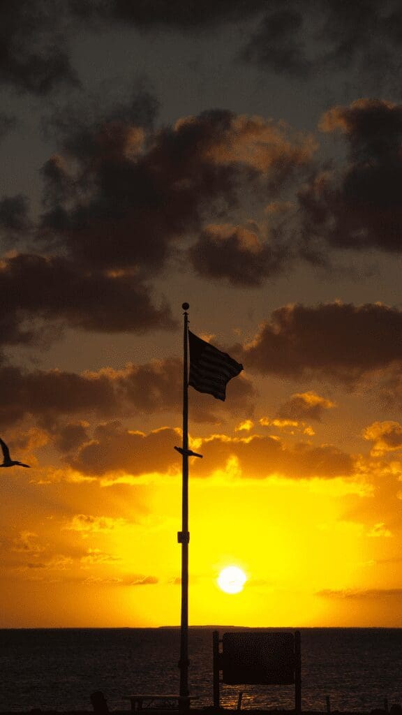 sunset at Biscayne National Park with american flag flying