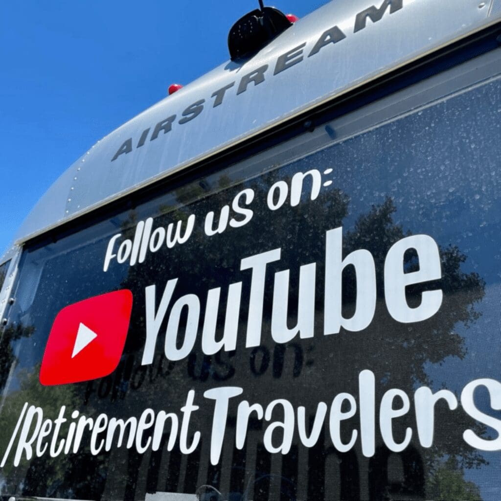 A YouTube logo on the back window of an RV