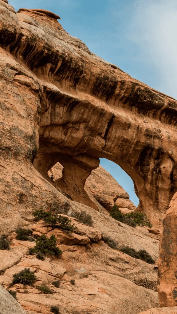 a rock formation that has three arches connected