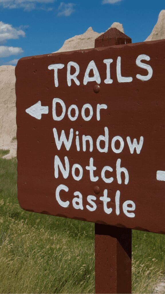 road sign pointing to door window or notch castle