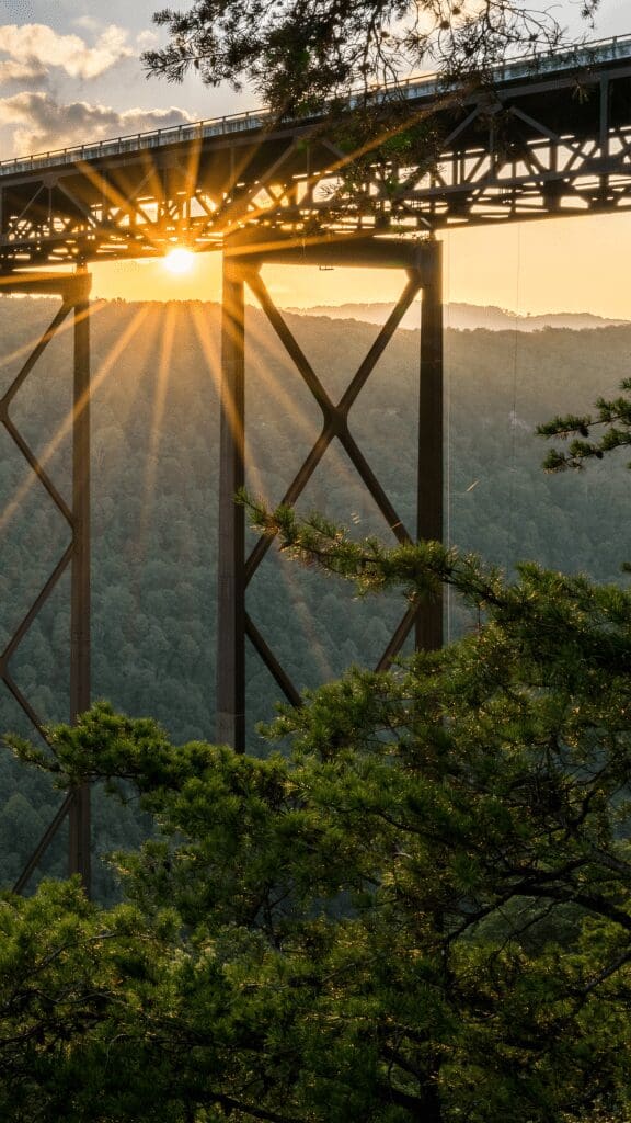 view of bridge with sun rising behind