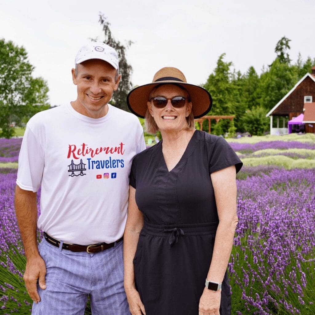 A man and woman standing in a lavender field