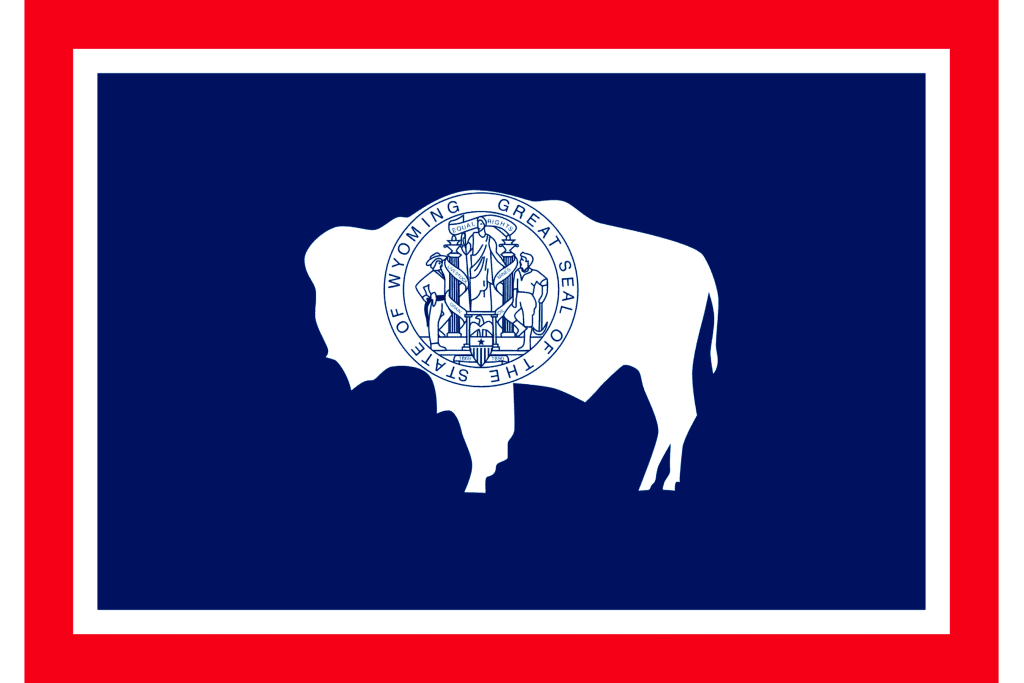 Red and blue flag with white bison emblem, which is the Wyoming state flag
