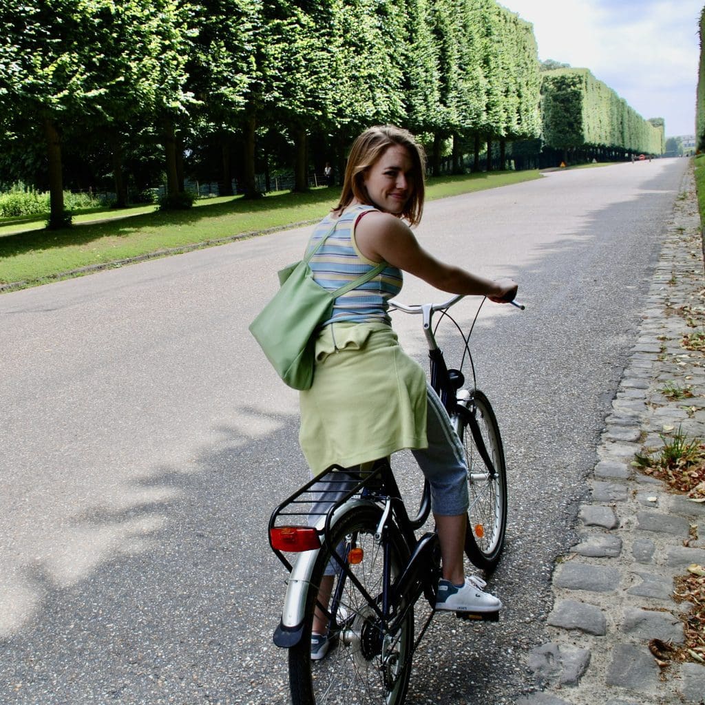 Girl on bike touring Versilles