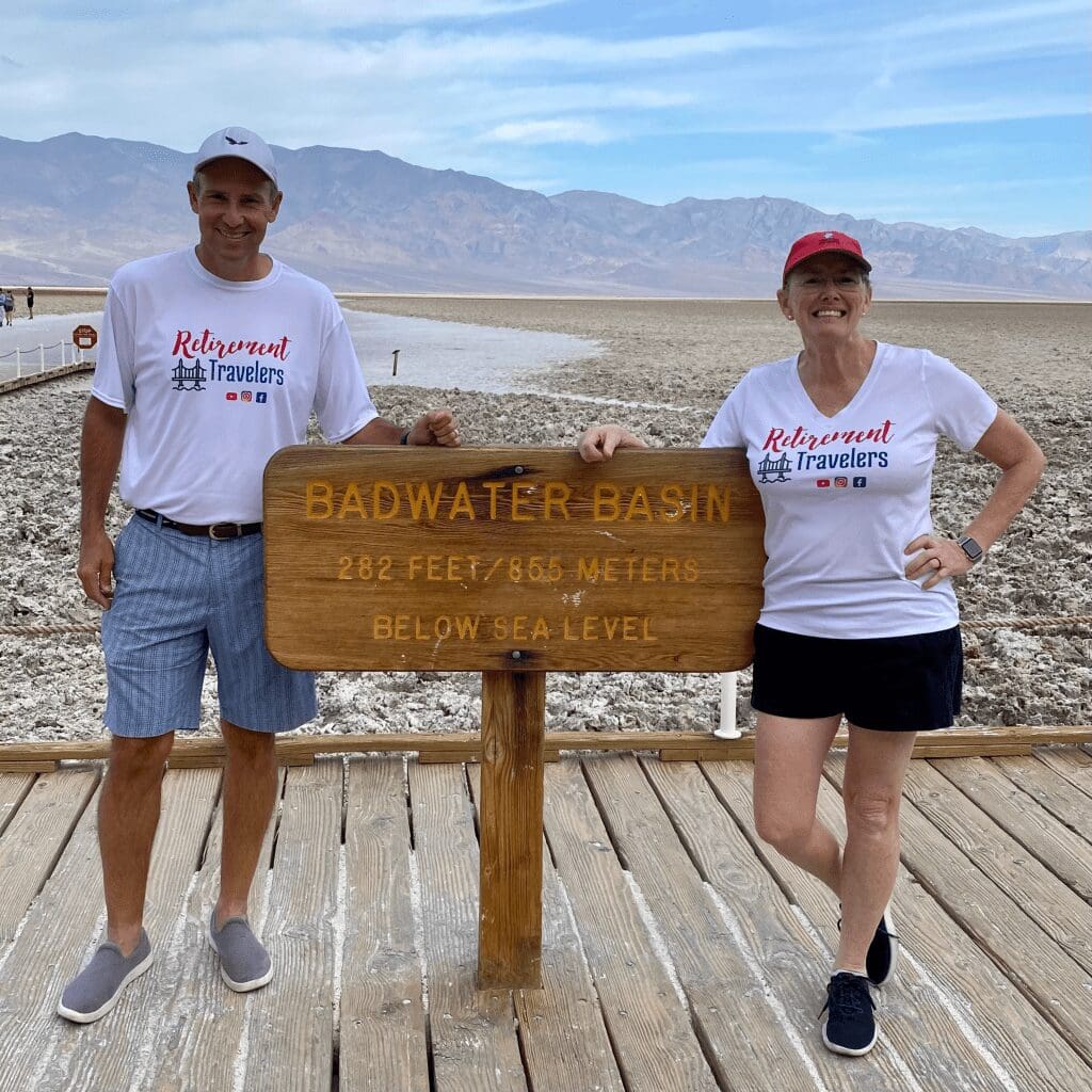 john and bev in front of sign for lowest place in north america
