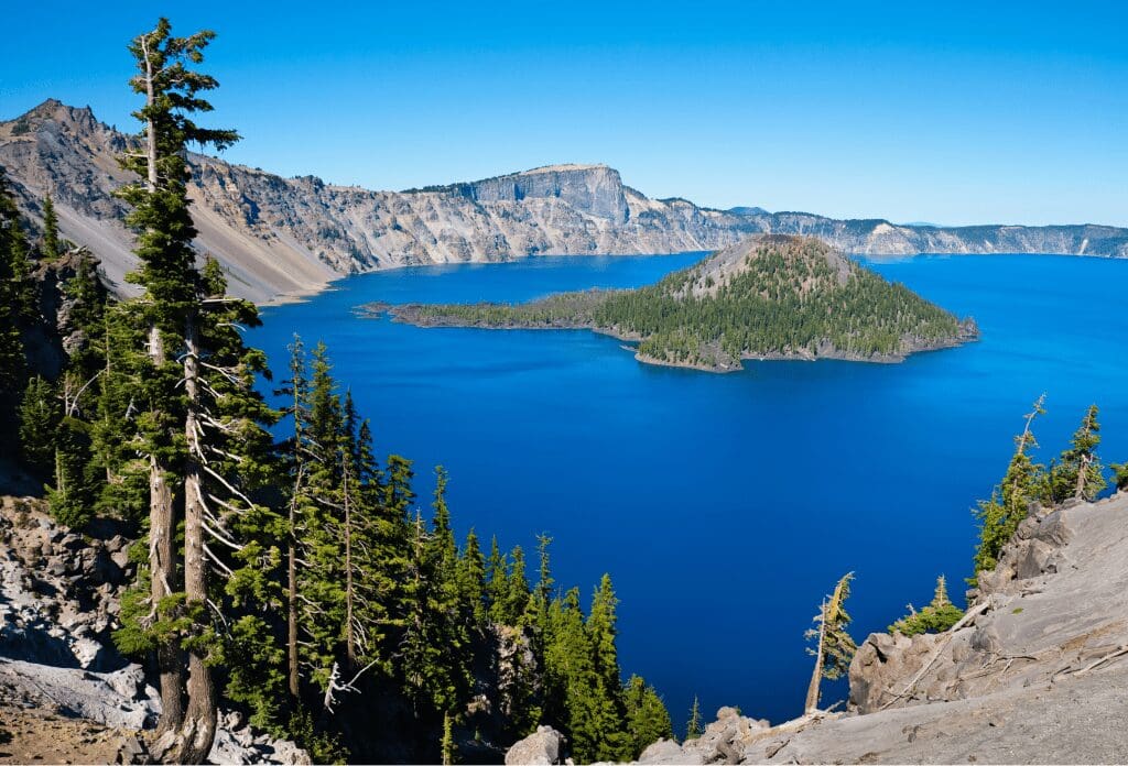 view of blue water and island in crater lake