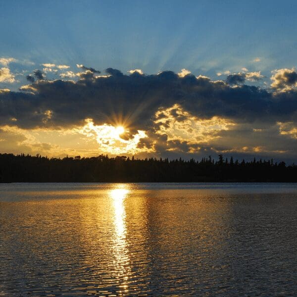 sunset over water with golden reflection of the blue sky at Isle Royale National Park