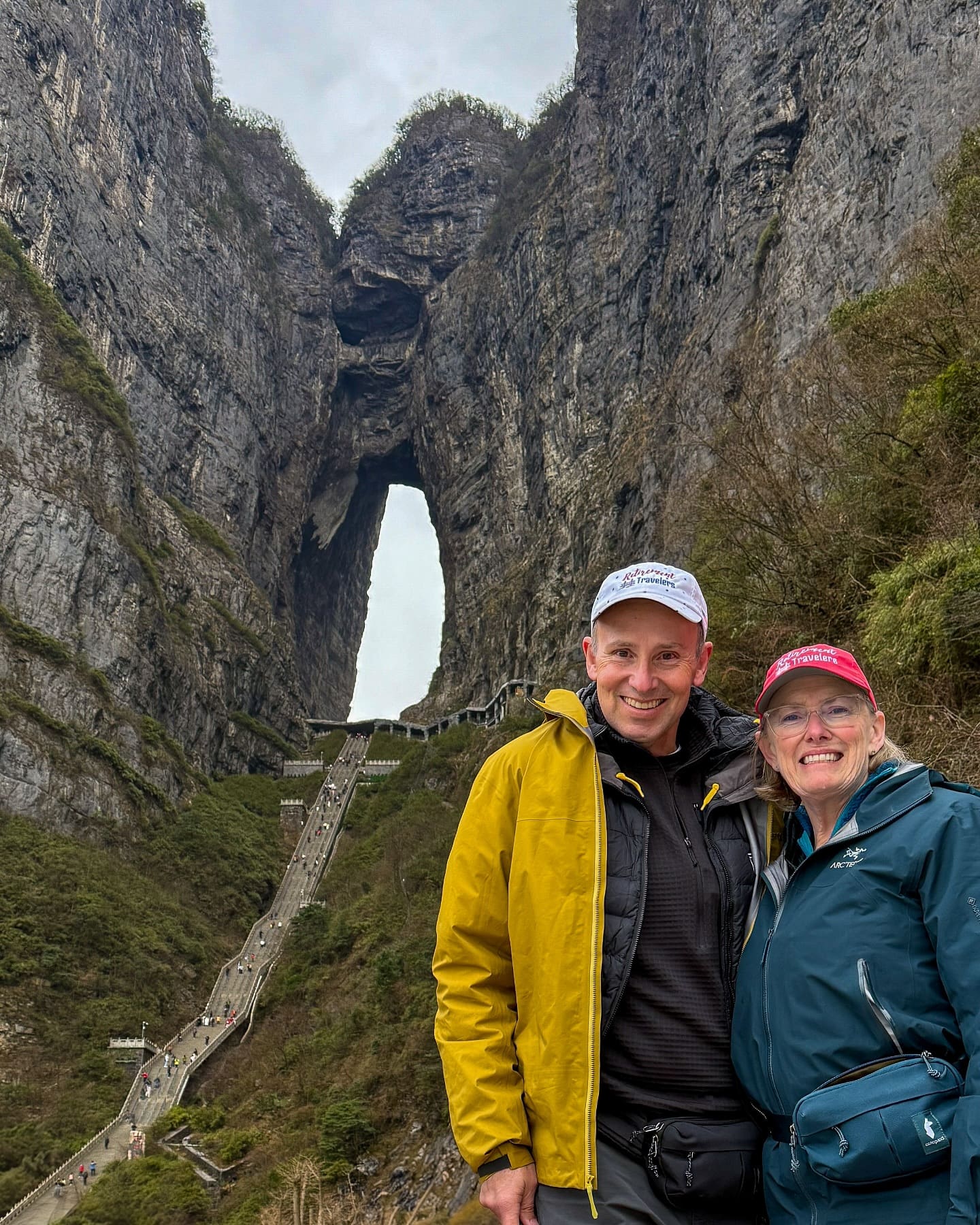 Tianmen Mountain was our third incredible attraction near Zhangjiajie, China. The mountain can be accessed from the city by two different exhilarating aerial trams or a dangerous highway featuring 99 hairpin turns. Tianmen literally means “Heaven’s Gate” and the 999 stairs leading up to the opening are known as the Stairway to Heaven. Climbing this stairway was another bucket list experience for us, so we took our time on the steep steps and just savored every moment. After passing through the gate, a long series of escalators take you up through the inside of the mountain to the top, where they have a glass-bottomed walkway hugging a cliffside and many great views of the area.
#china #tianmen #tianmenmountain