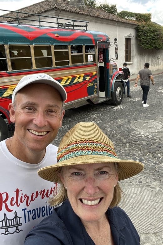 john & Bev in front of chicken bus near Guatemala street food