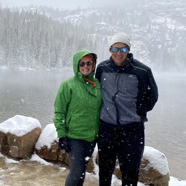 john & bev standing in the snow at Rocky Mountain National Park