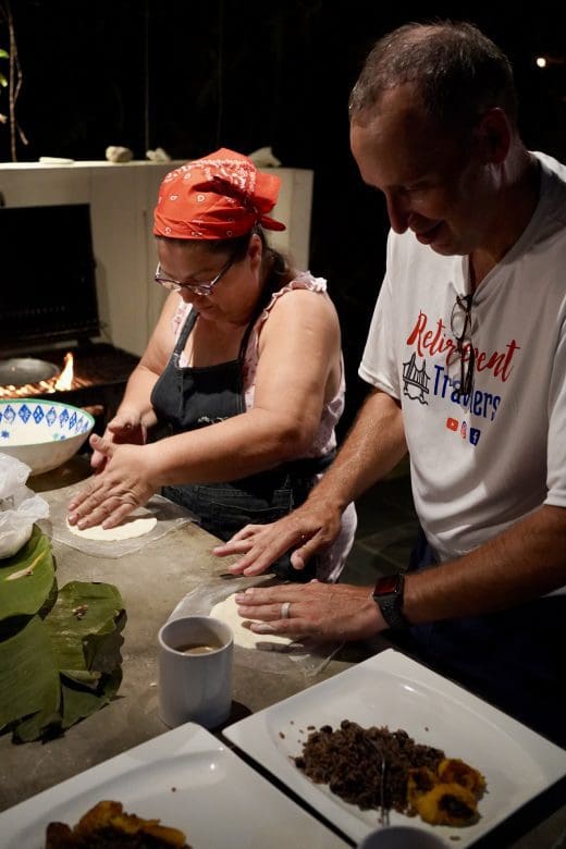 john and woman making tortillas by hand