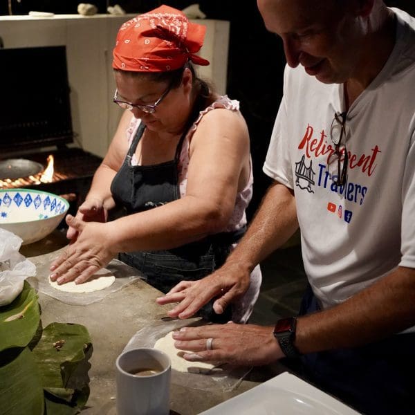 john and woman making tortillas by hand