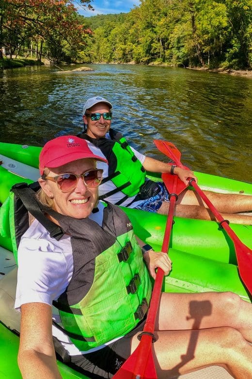 Bev and John on green rafts on Tuckasegee River in Sylva, North Carolina