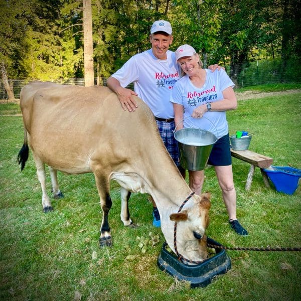 Bev & JOhn with cow and milk in bucket