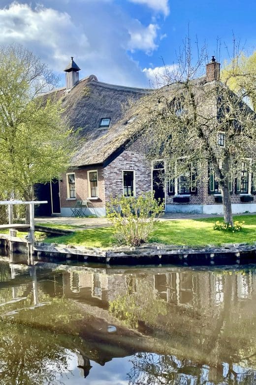 cottage along the water with reflection in Giethoorn Netherlands