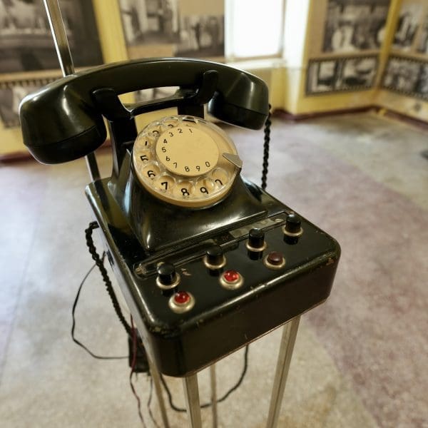 Old dial telephone on a stand