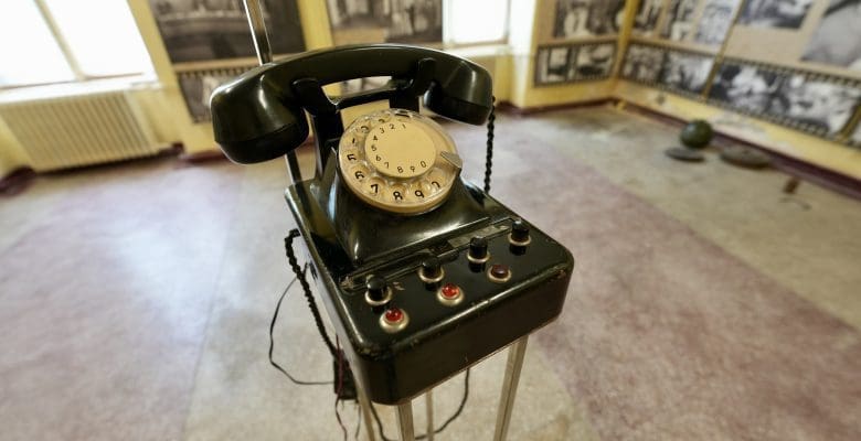 Old dial telephone on a stand