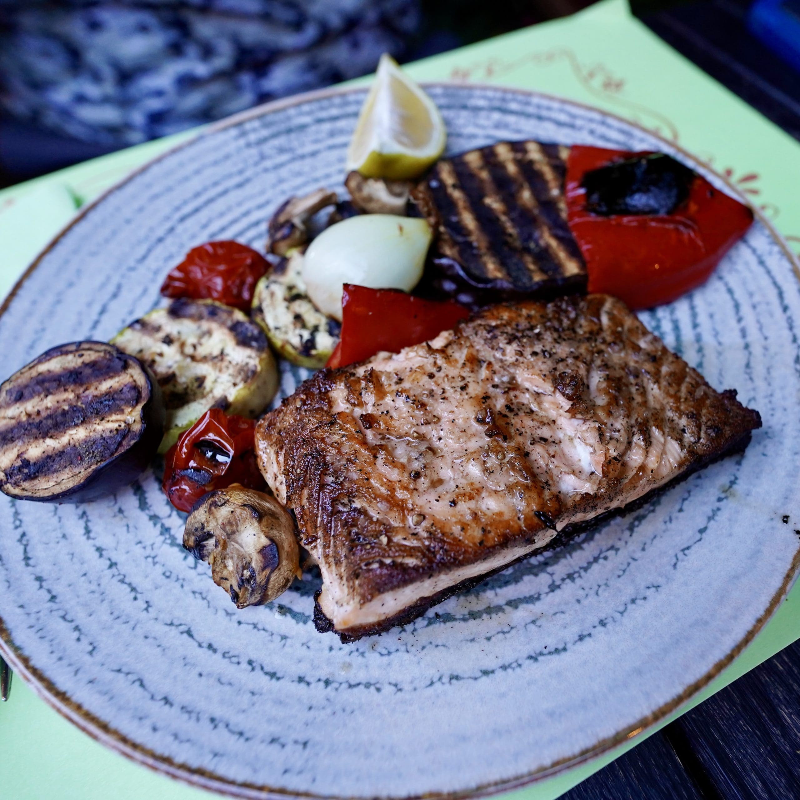 grilled salmon on plate with vegetables