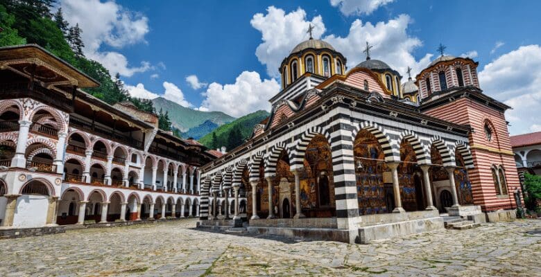 a view of the stripped columns and painted monastery