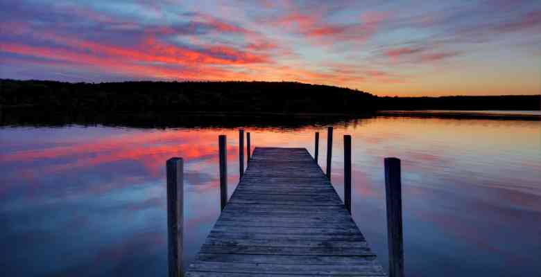 wooden dock on a lake at sunset in Vermont