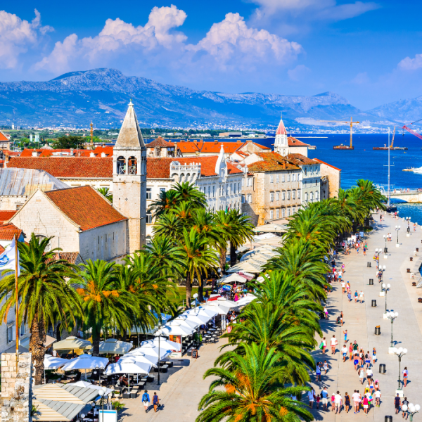 A port with boats in the Croatian city of Split with red tiled roofs