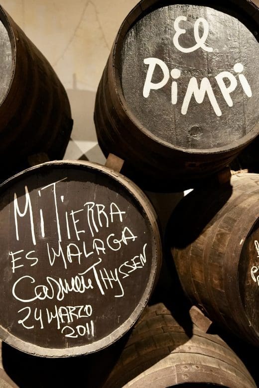 Dark barrels outside a restaurant in Malaga Spain