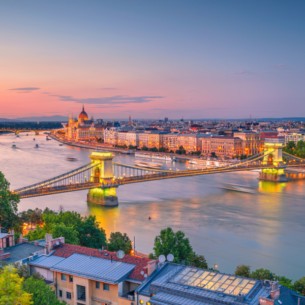 Aerial view of the Danube river going through Budapest Hungary with a beautiful lit bridge