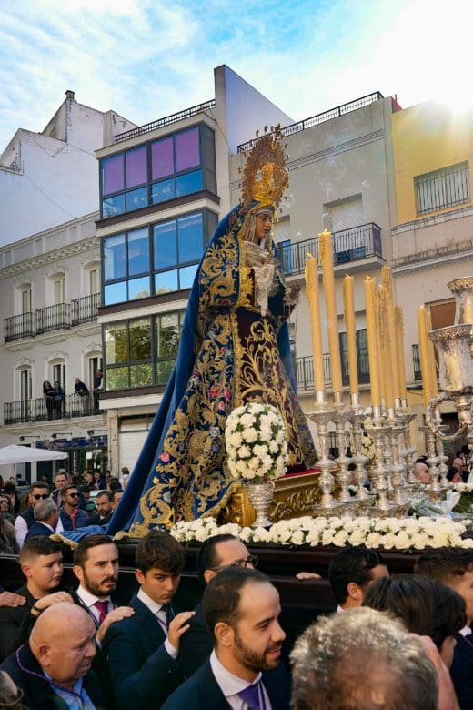 Holy procession entering a church in Seville, Spain