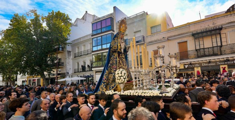 Holy procession entering a church in Seville, Spain