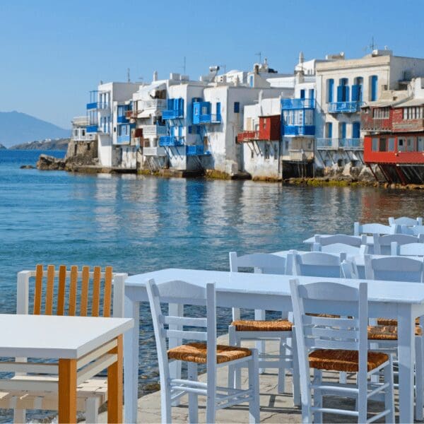 Restaurant tables and buildings along the Mykonos, Greece waterfront