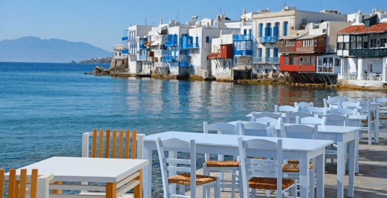 Restaurant tables and buildings along the Mykonos, Greece waterfront