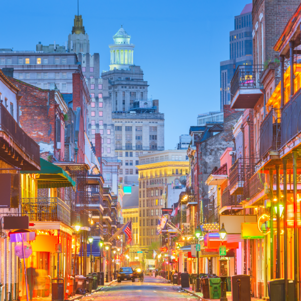 A street view of hotels, bars, and restaurants in the French Quarter of New Orleans.