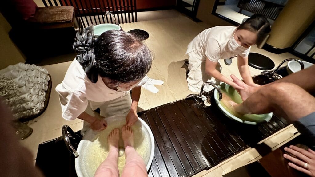 2 people getting their feet cleaned at Thai massage spa