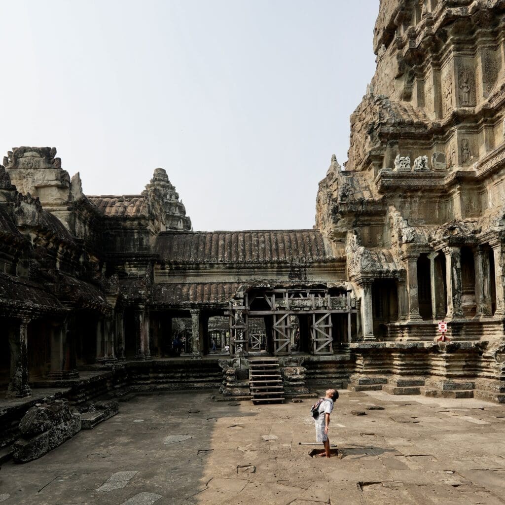 man praying in ancient temple