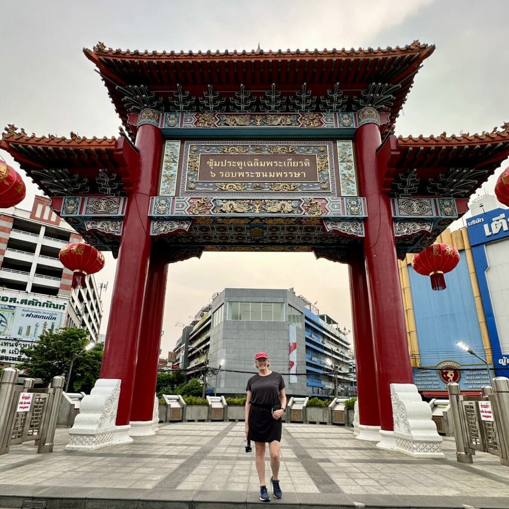 Woman standing in Chinatown gate in Bangkok