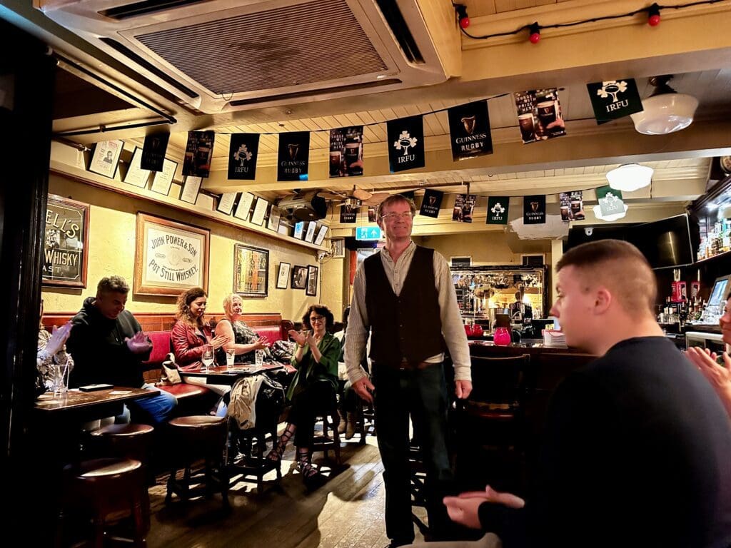 man inside an Irish pub telling folklore stories