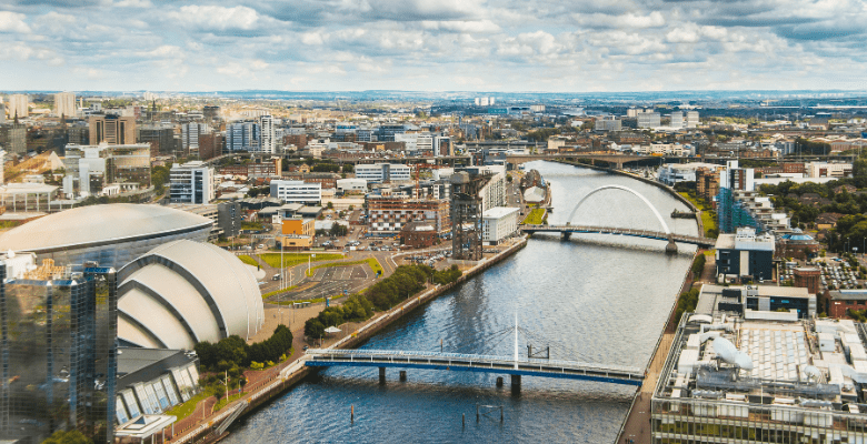 aerial view of Glasgow, Scotland with buildings, river and bridges