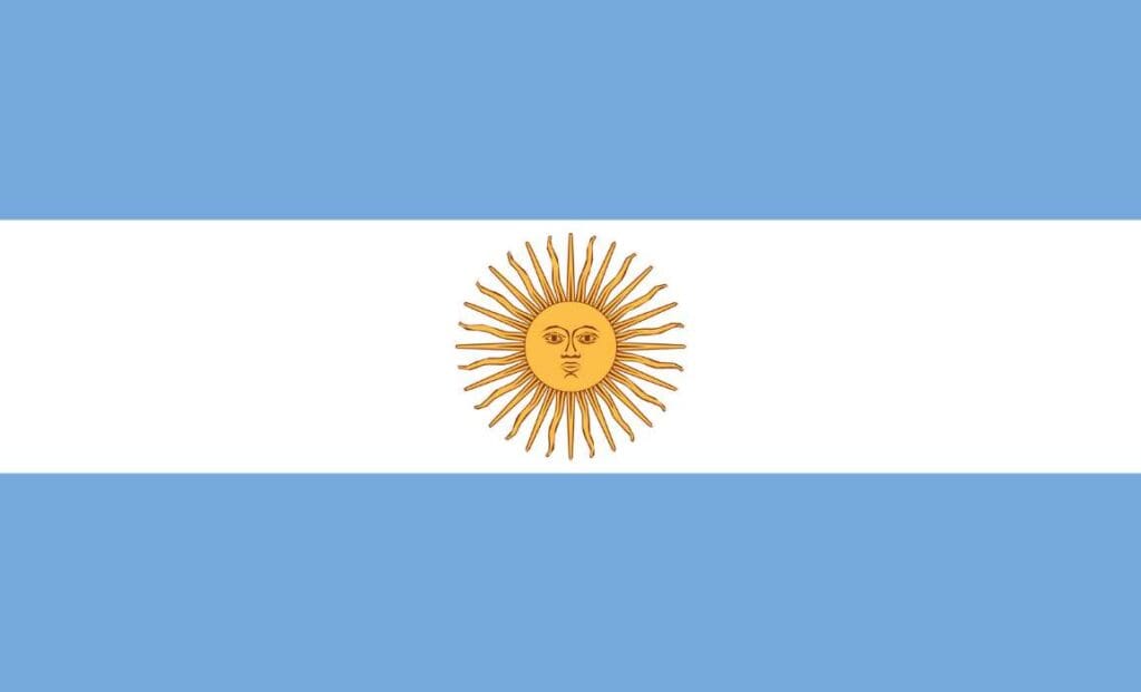 A light blue and white flag with a golden sun in the middle.