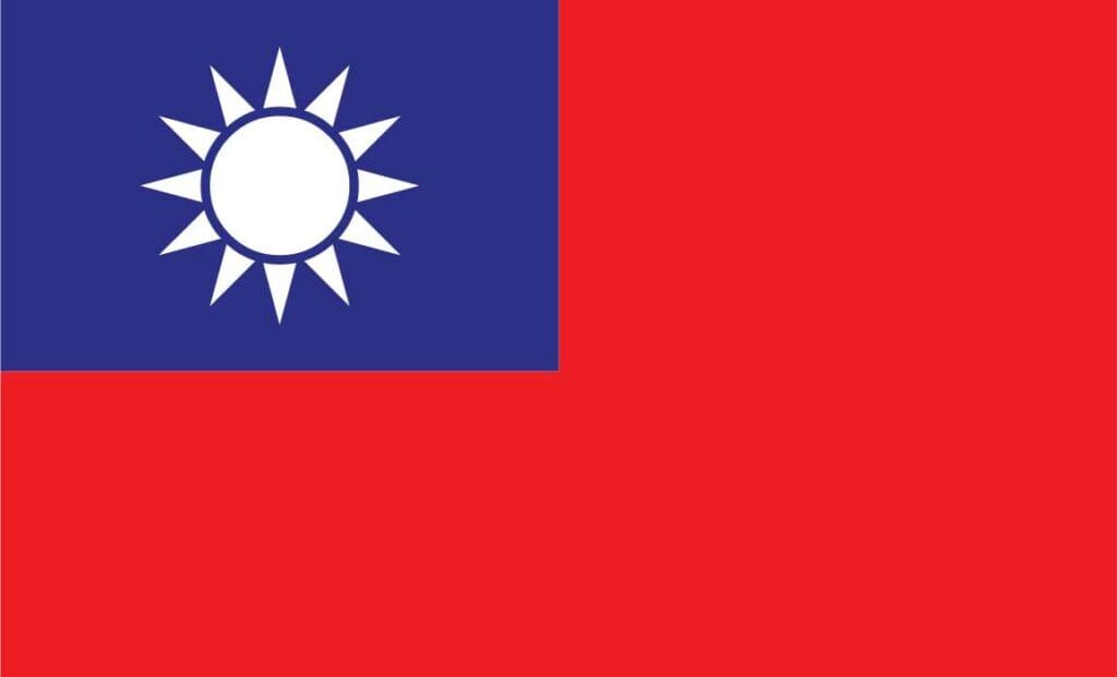 A red flag with a blue rectangle in upper left corner with white sun.