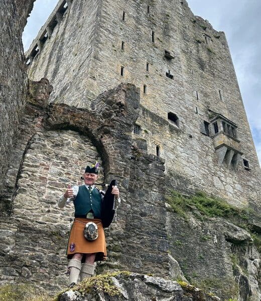 bagpipe player by blarney castle in Ireland