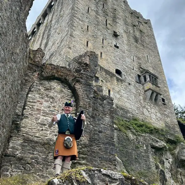 bagpipe player by blarney castle in Ireland