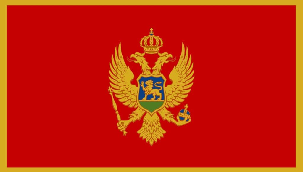 A red flag with a gold border and emblem of eagles