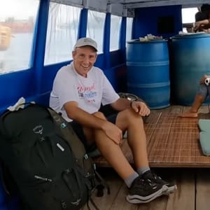 john in a boat in raja ampat