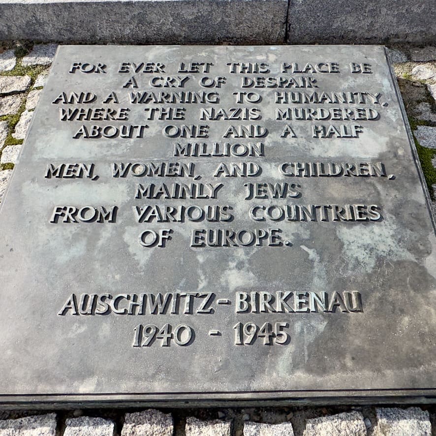 Memorial stone with engraving in Auschwitz