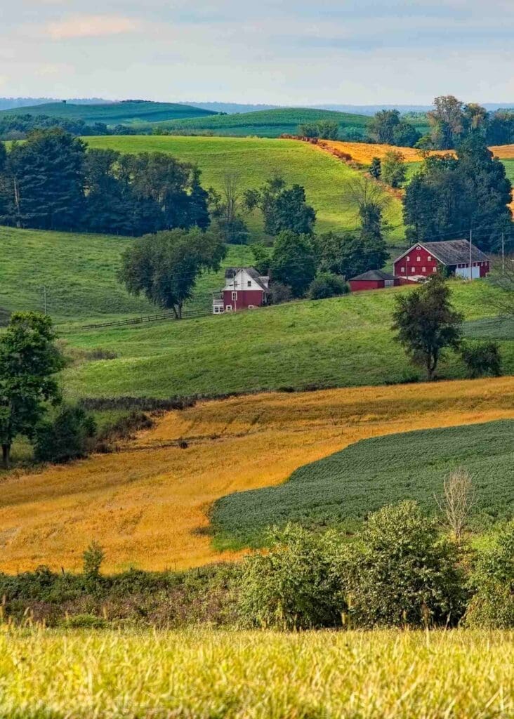 A pasture with red barn and house in Ohio.