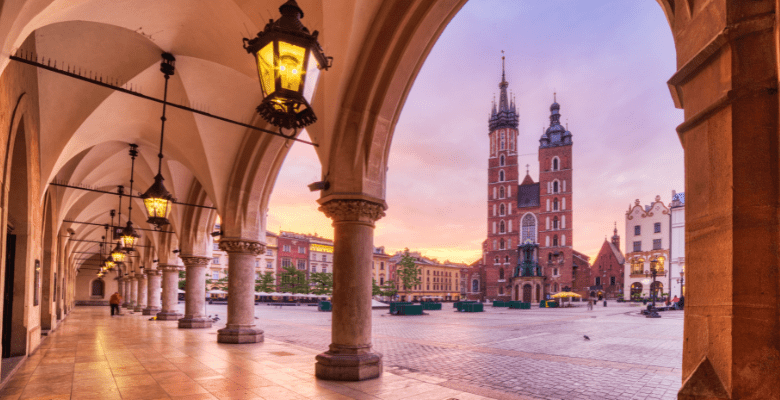 view of St Mary's basilica in krakow poland through arches of another building